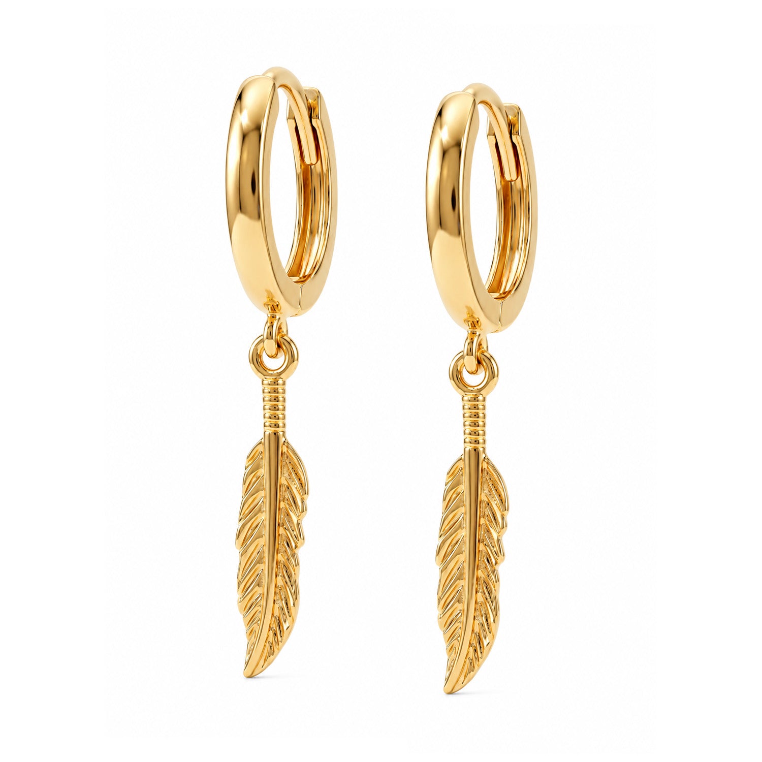A pair of gold huggie hoop earrings with dangling feather charms, shown on a plain white background.