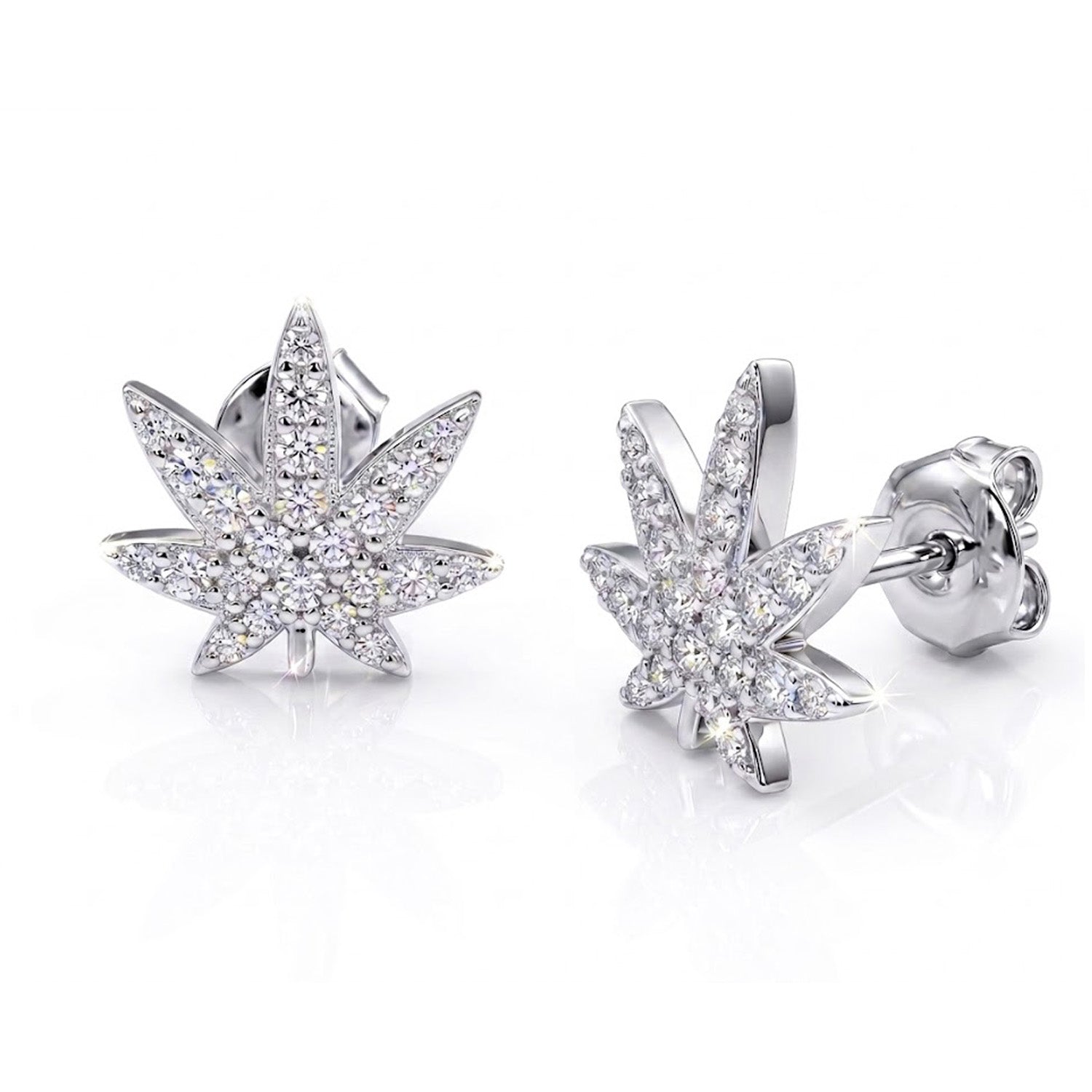Silver cannabis leaf earrings with clear gemstones on a white background