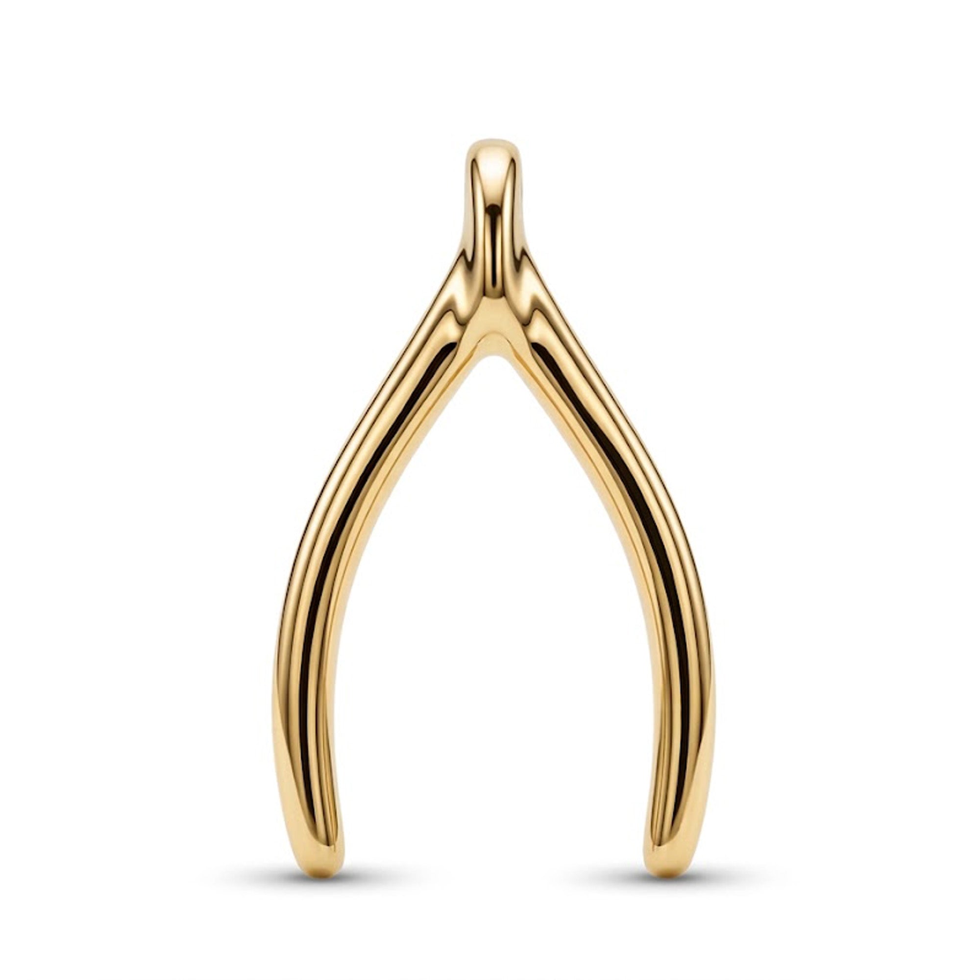 A polished yellow gold wishbone charm pendant, resembling a wishbone, shown on a clean white background with a soft shadow underneath.