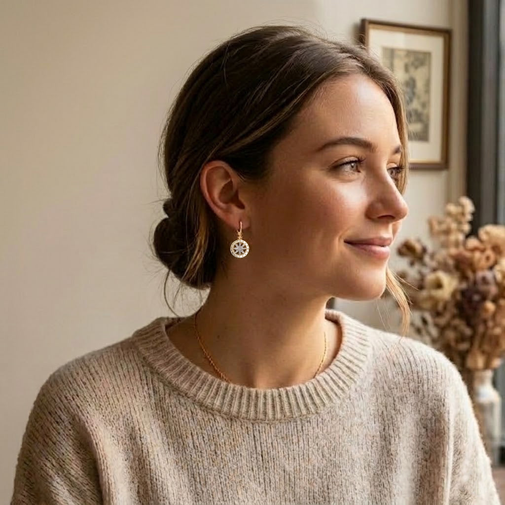 Woman wearing a beige sweater with a neutral background
