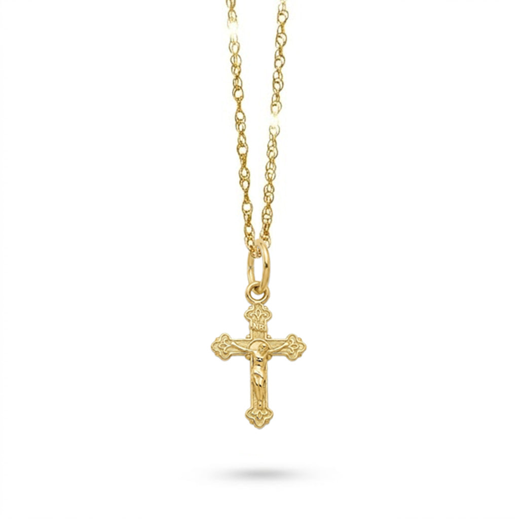 Gold crucifix cross necklace on a white background