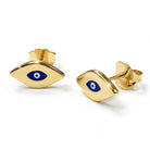 Gold evil eye earrings with blue centers on a white background