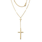 Gold cross necklace on a white background
