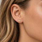 Gold dog bone earring stud