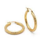 A pair of gold hoop earrings with a textured, diamond-patterned finish, displayed on a clean white background.