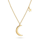 A gold necklace featuring a polished crescent moon pendant and a small dangling star charm, displayed against a clean white background.