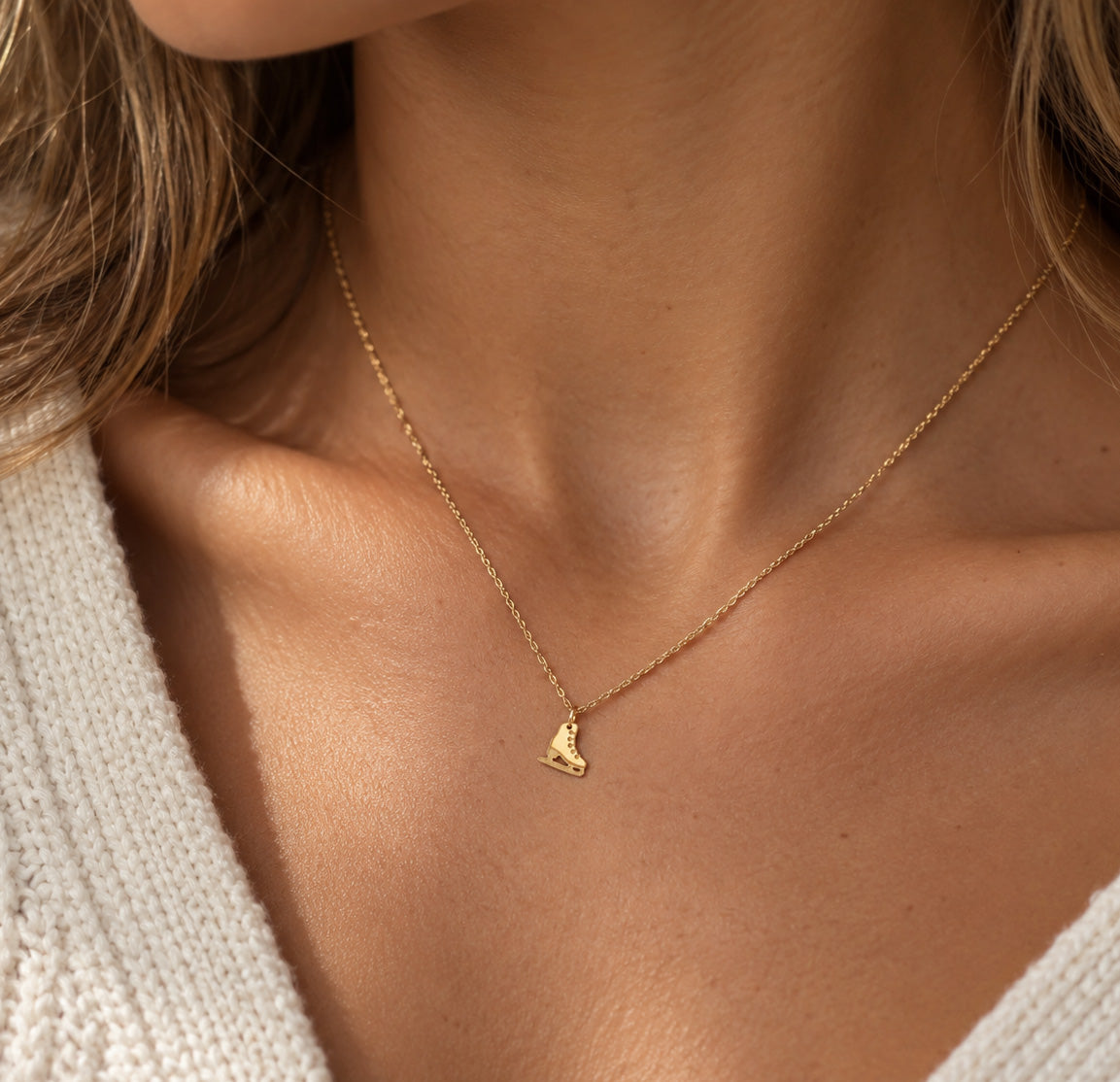 Gold ice skate shoe necklace