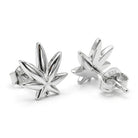 A pair of sterling silver stud earrings shaped like cannabis leaves, shown on a clean white background. One earring is displayed from the front, and the other shows the side profile with a '925' silver purity stamp on the post.