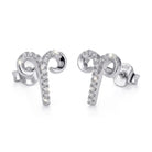 [group: silver-aries] Silver aries earrings with intricate designs on a white background