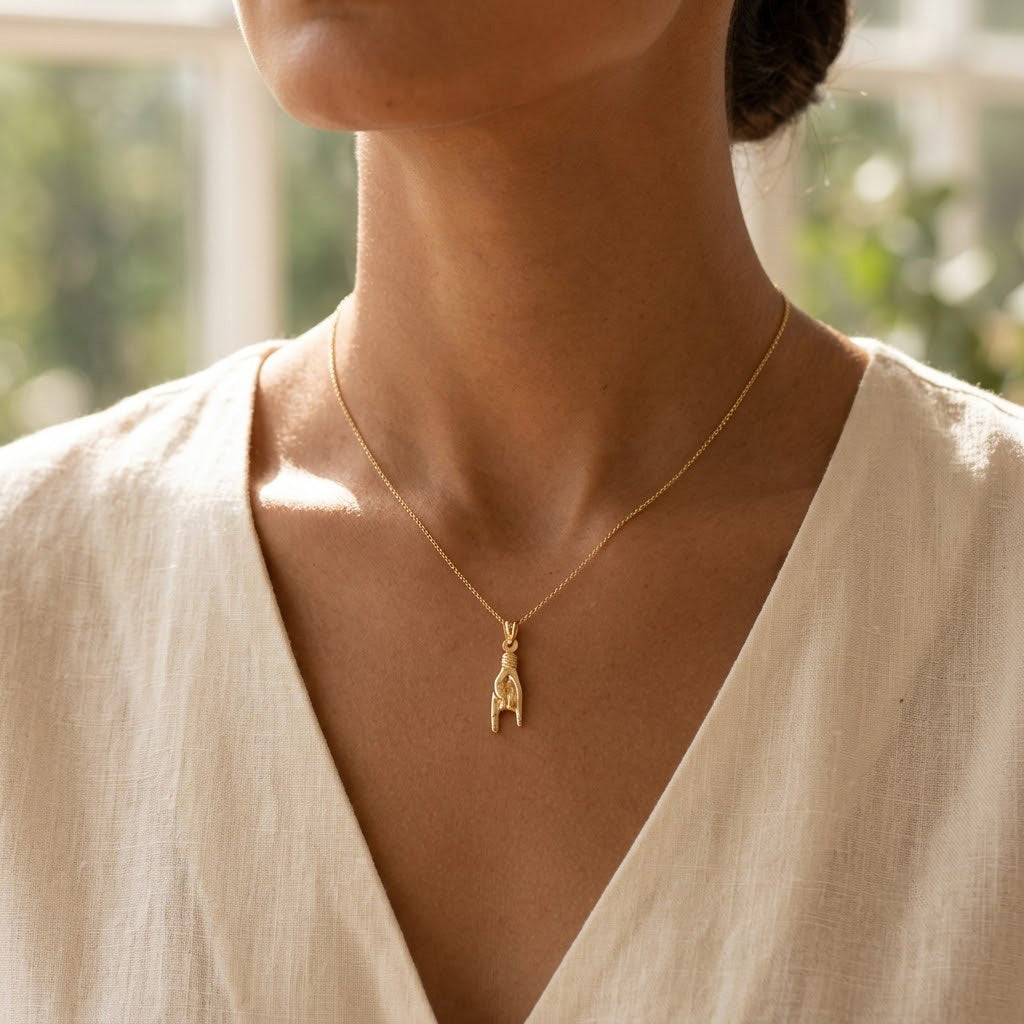 [group: large] Gold Mano Cornuto Pendant