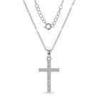 Silver cross pendant necklace on a white background