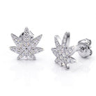 Silver cannabis leaf earrings with clear gemstones on a white background