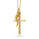 A polished yellow gold cross pendant necklace with a stylized dove in flight draped over the left side of the cross, suspended from a delicate gold chain against a plain white background.