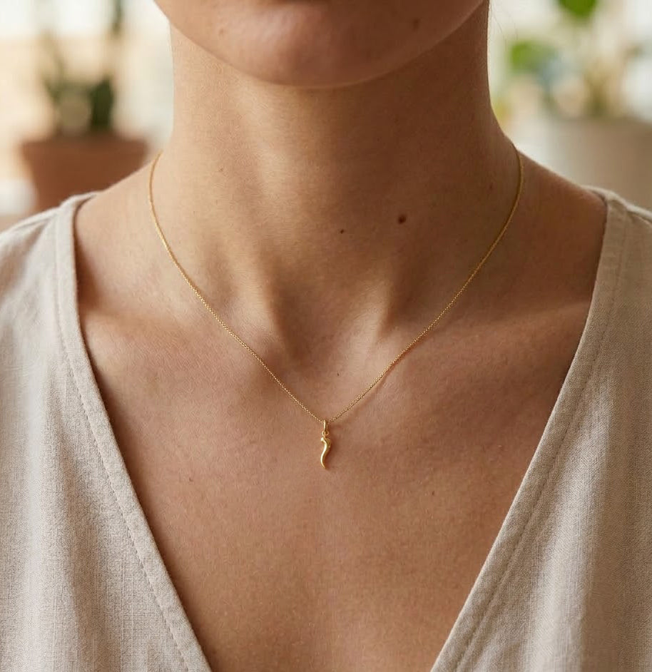 [group: mini] Gold Italian Horn Pendant  on female model 