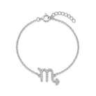 [group:sco]   A silver chain bracelet featuring a dangling zodiac sign 'Scorpio' charm paved with small clear stones, shown on a plain white background.