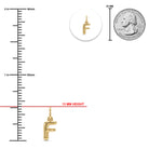 [group: f-10k-gold]Gold initial pendant charm shaped like the letter 'F', shown with a measurement ruler in millimeters, a 25 mm US quarter coin for scale, and a small circular inset of the pendant.