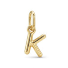 [group: k-10k-gold] A polished gold initial pendant charm shaped like the letter 'K', shown on a clean white background.