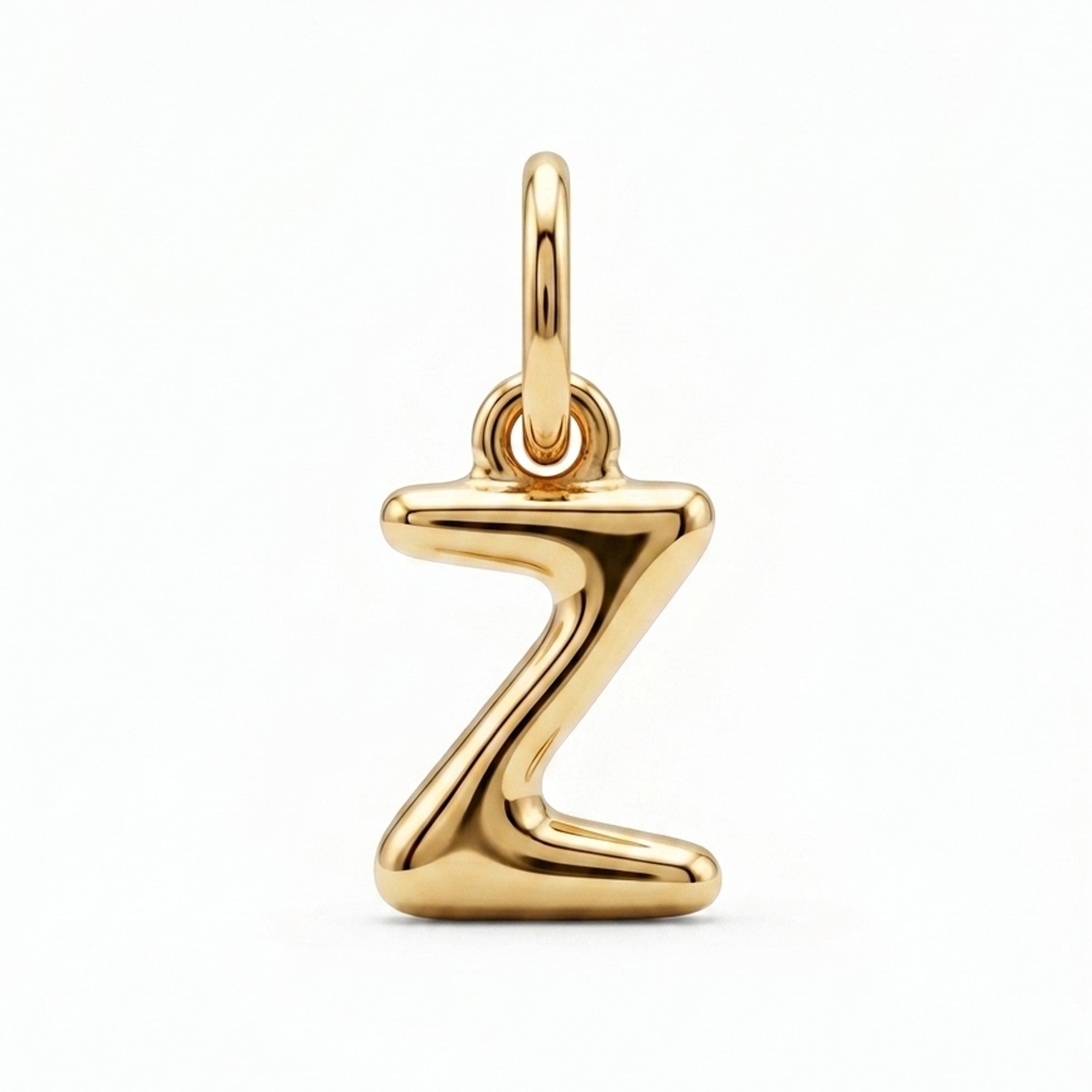 [group: z-10k-gold] A polished gold initial pendant charm shaped like the letter 'Z', featuring a smooth, reflective metallic finish and a top loop for attachment, shown on a clean white background.