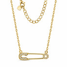 [group: gold-plated]A gold safety pin pendant necklace adorned with small clear crystals, shown on a clean white background with its clasp and extender chain visible.
