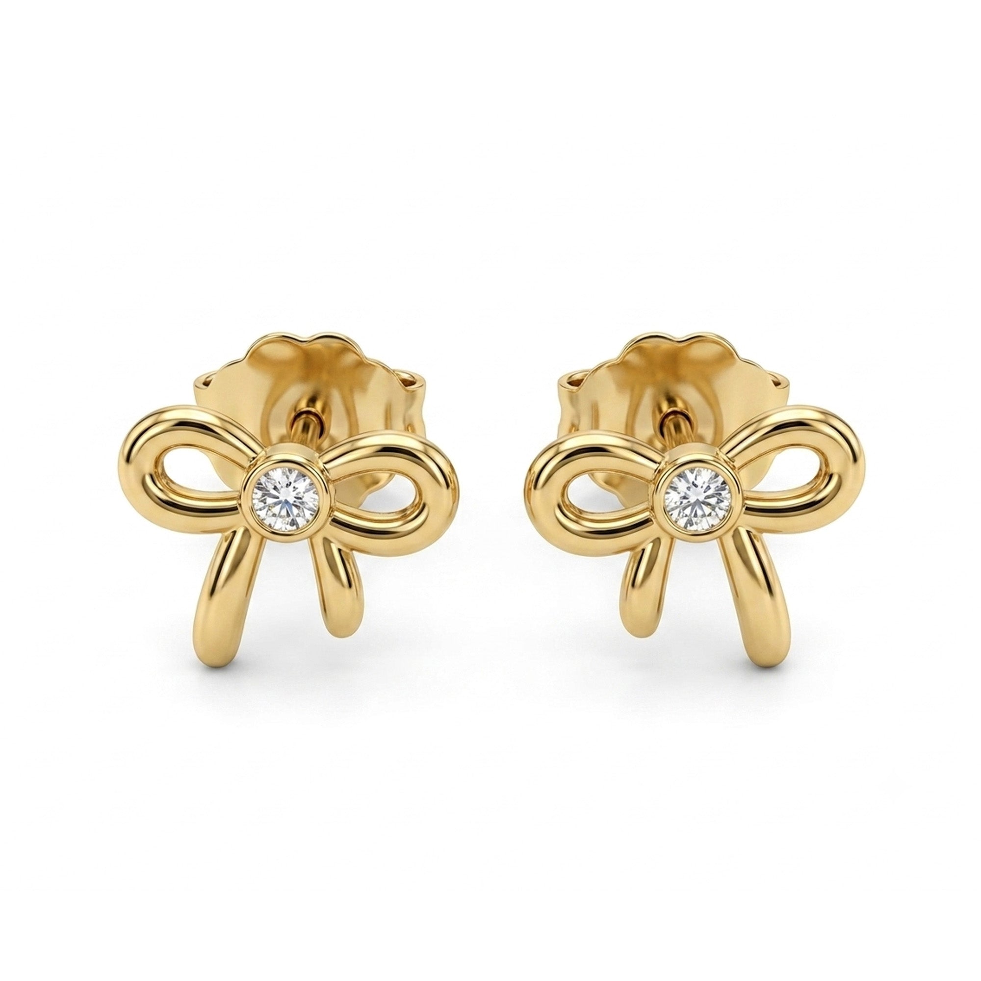 A pair of gold bow stud earrings with a single round-cut clear diamond at the center of each bow, shown on a plain white background.
