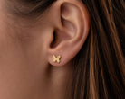 Gold butterfly earring 