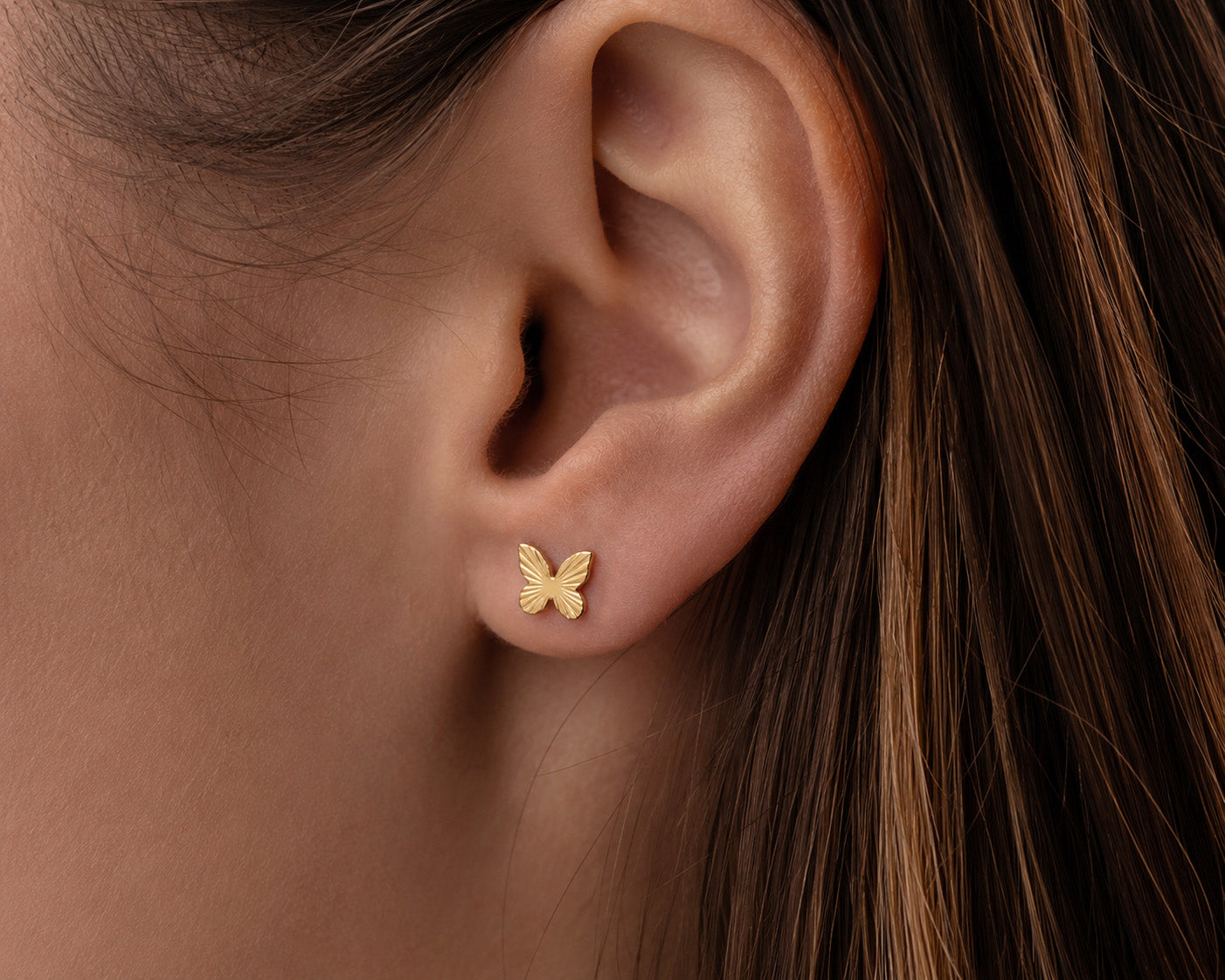 Gold butterfly earring 