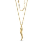 A gold necklace featuring a polished, curved pendant resembling a stylized chili pepper, suspended from a delicate gold chain with an adjustable extender, shown against a plain white background.