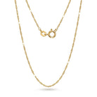 Gold chain necklace on a white background