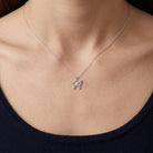Silver butterfly Necklace worn by female model 