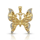 Gold butterfly pendant with diamond-cut accents on a white background