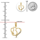 Gold pendant with heart design next to a ruler and quarter for size reference