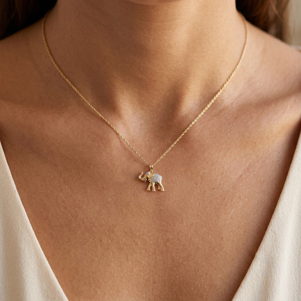 gold elephant pendant on gold rope chian 