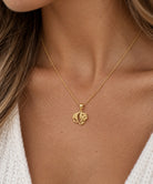 Gold Panda Pendant made from 10 karat gold  worn by female model on gold rope chain 
