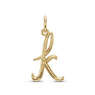 [group: k-10k-gold] A polished yellow gold initial pendant charm shaped like the lowercase letter 'k', shown on a clean white background.