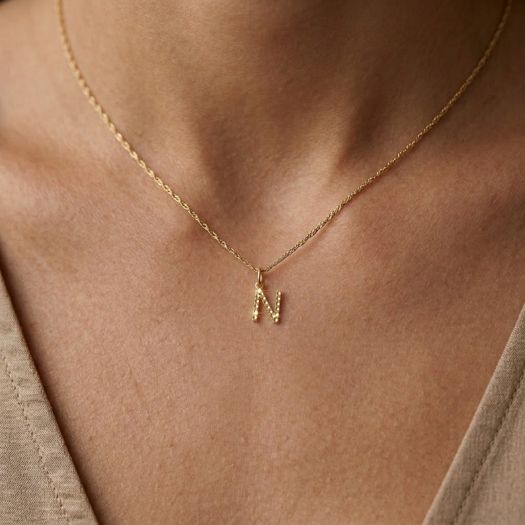 [group:n-10k-gold] Initial Pendant 