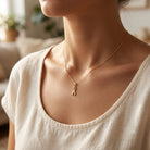 [group:gold-plated] Gold Plated Awareness Ribbon Necklace  on Model 
