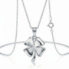 [group:silver] Silver four-leaf clover pendant on a chain against a white background