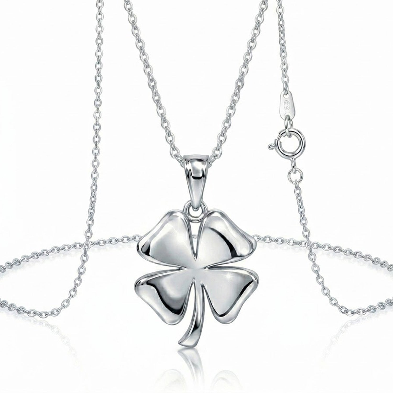 [group:silver] Silver four-leaf clover pendant on a chain against a white background