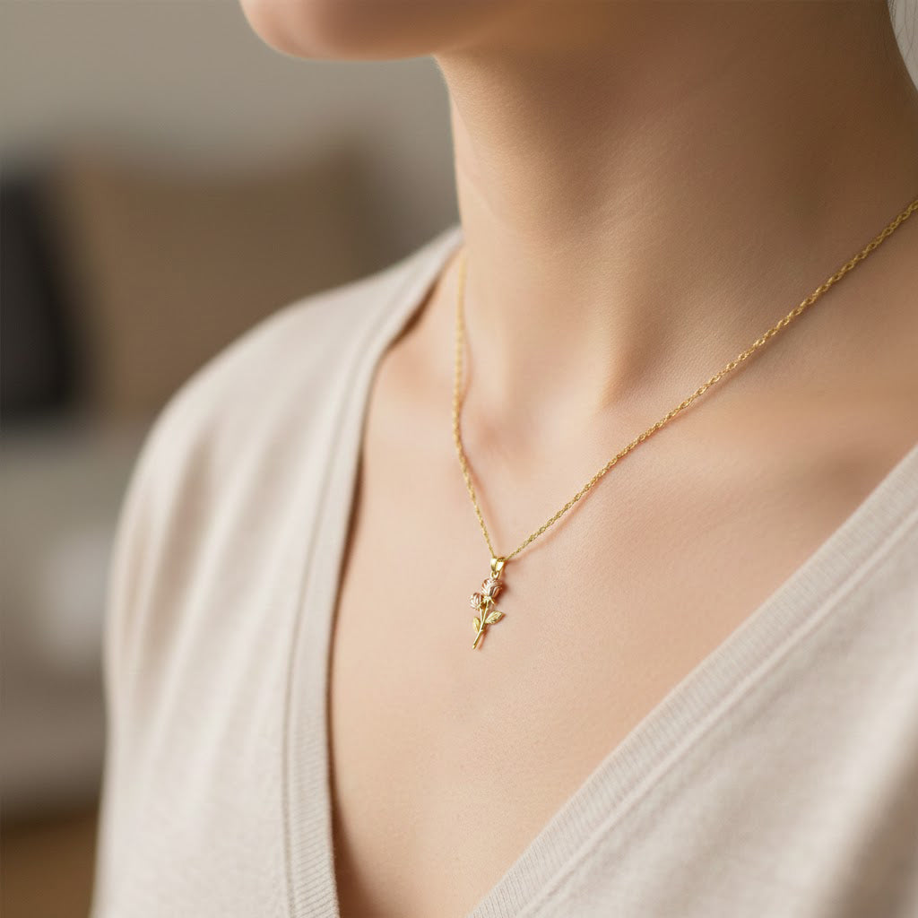 Gold Rose Pendant worn by female model on gold rope chain 