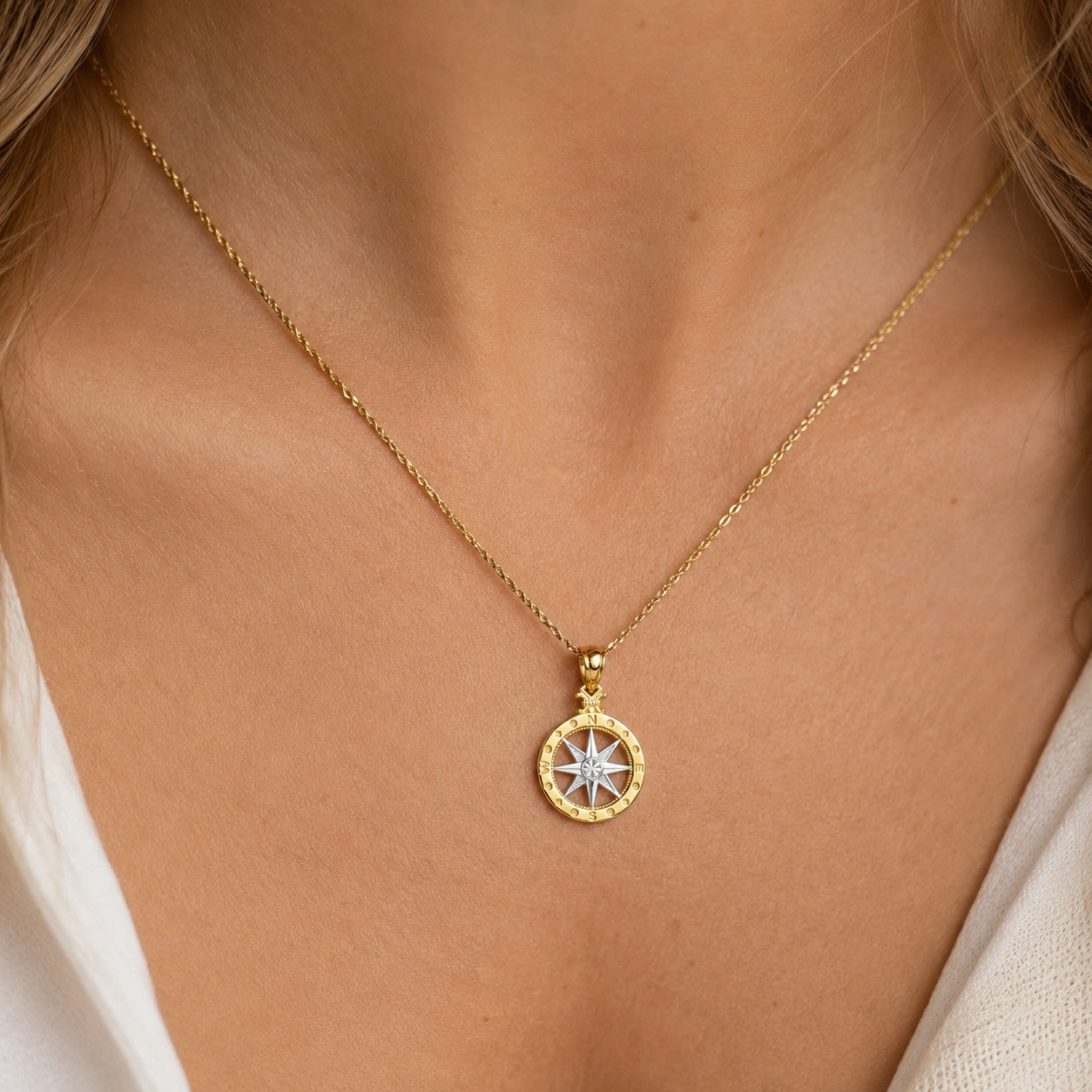 [group: small] Gold Compass Pendant worn by female model on gold rope chain 