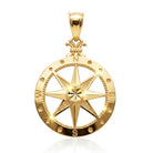 Gold compass pendant on a white background