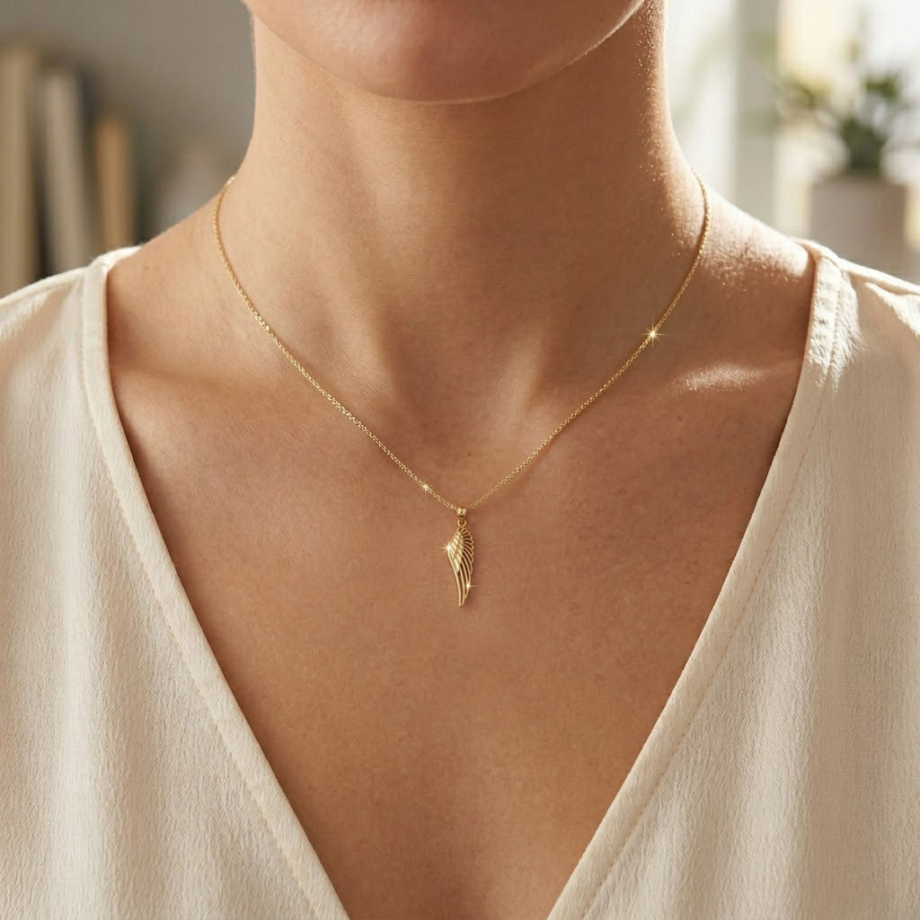 gold angel wing pendant 