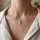 [group: silver] Silver pharaoh pendant on a female model 