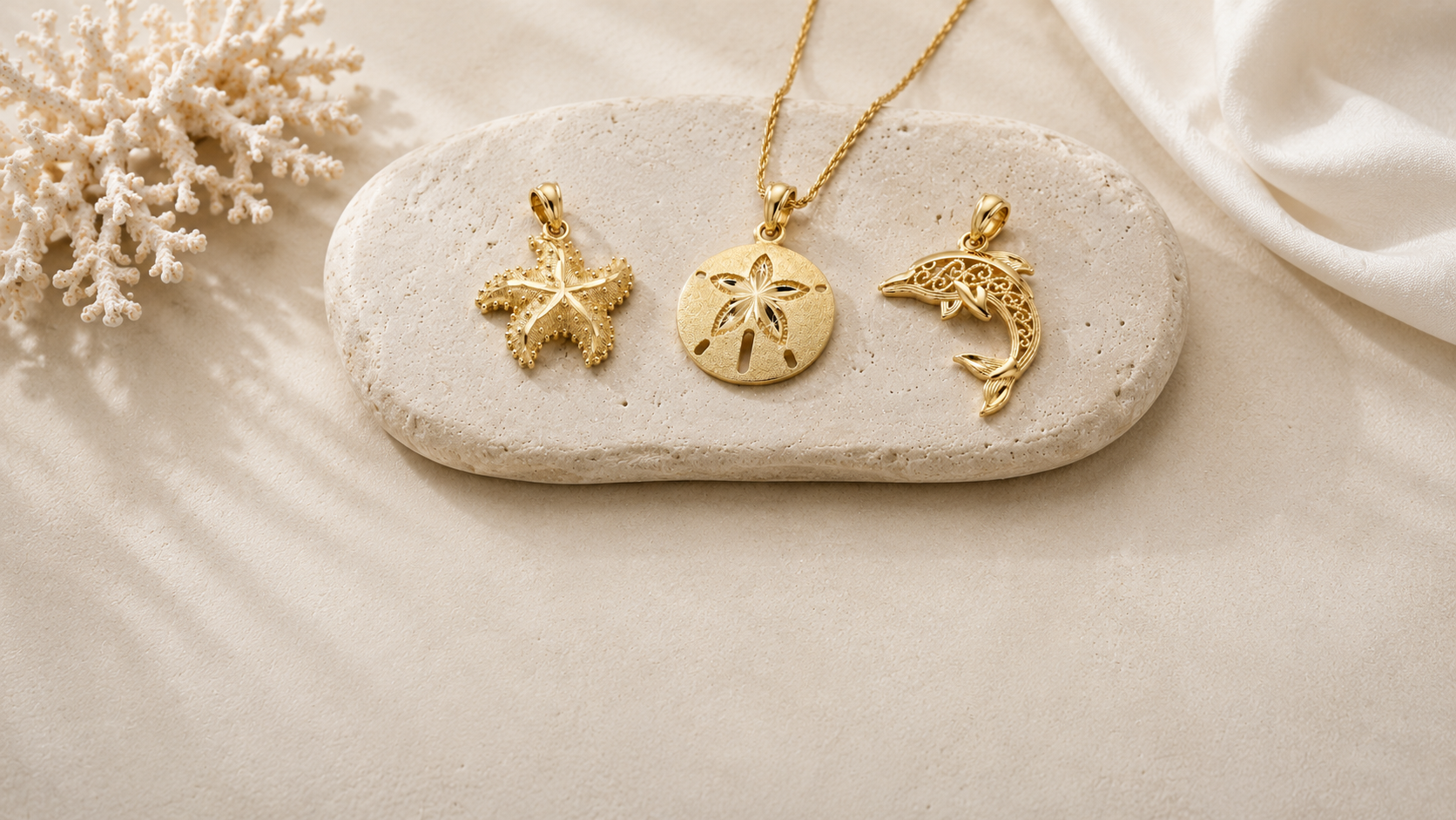 Three gold pendants on a stone with a natural background