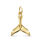 Gold whale tail pendant on a white background