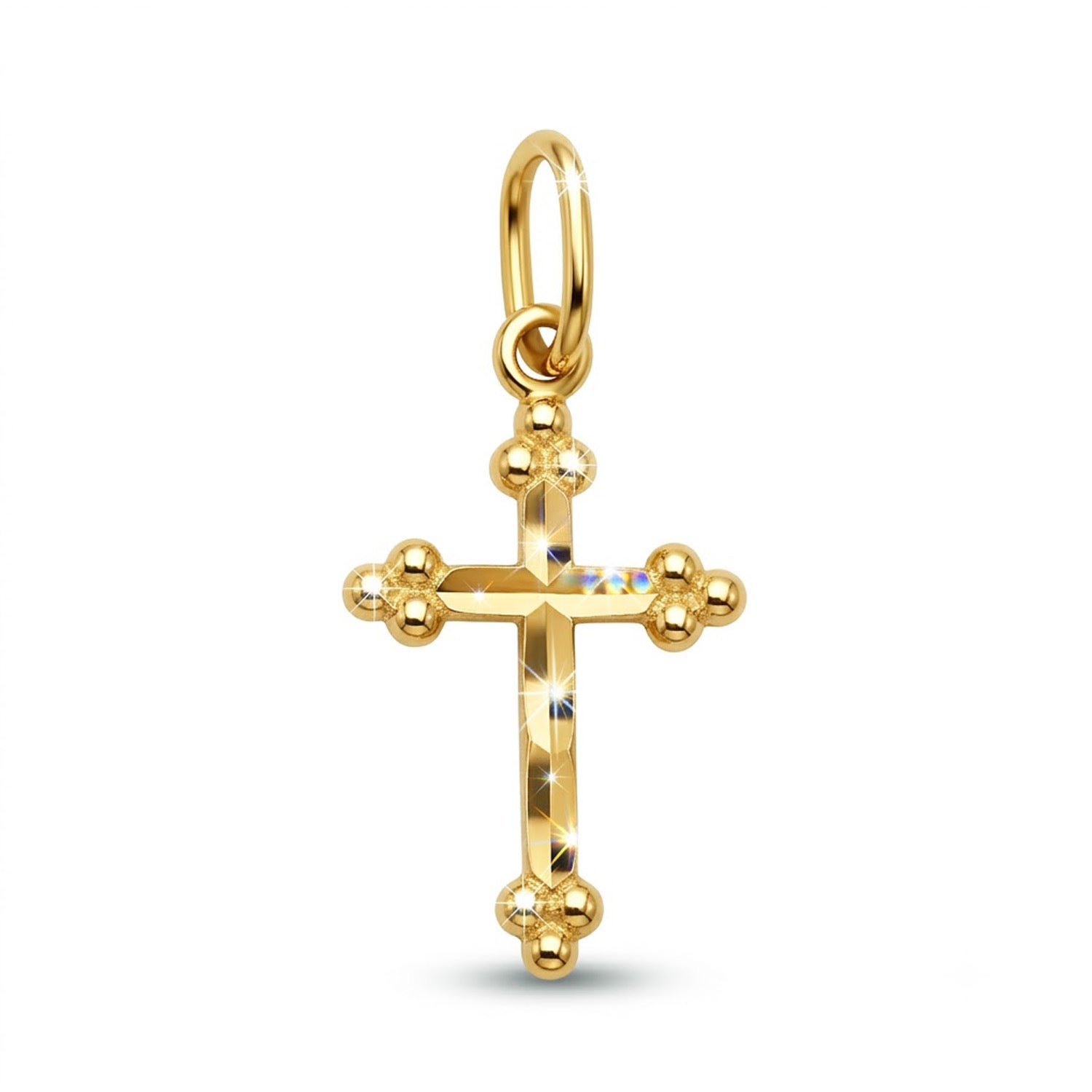Gold cross pendant on a white background