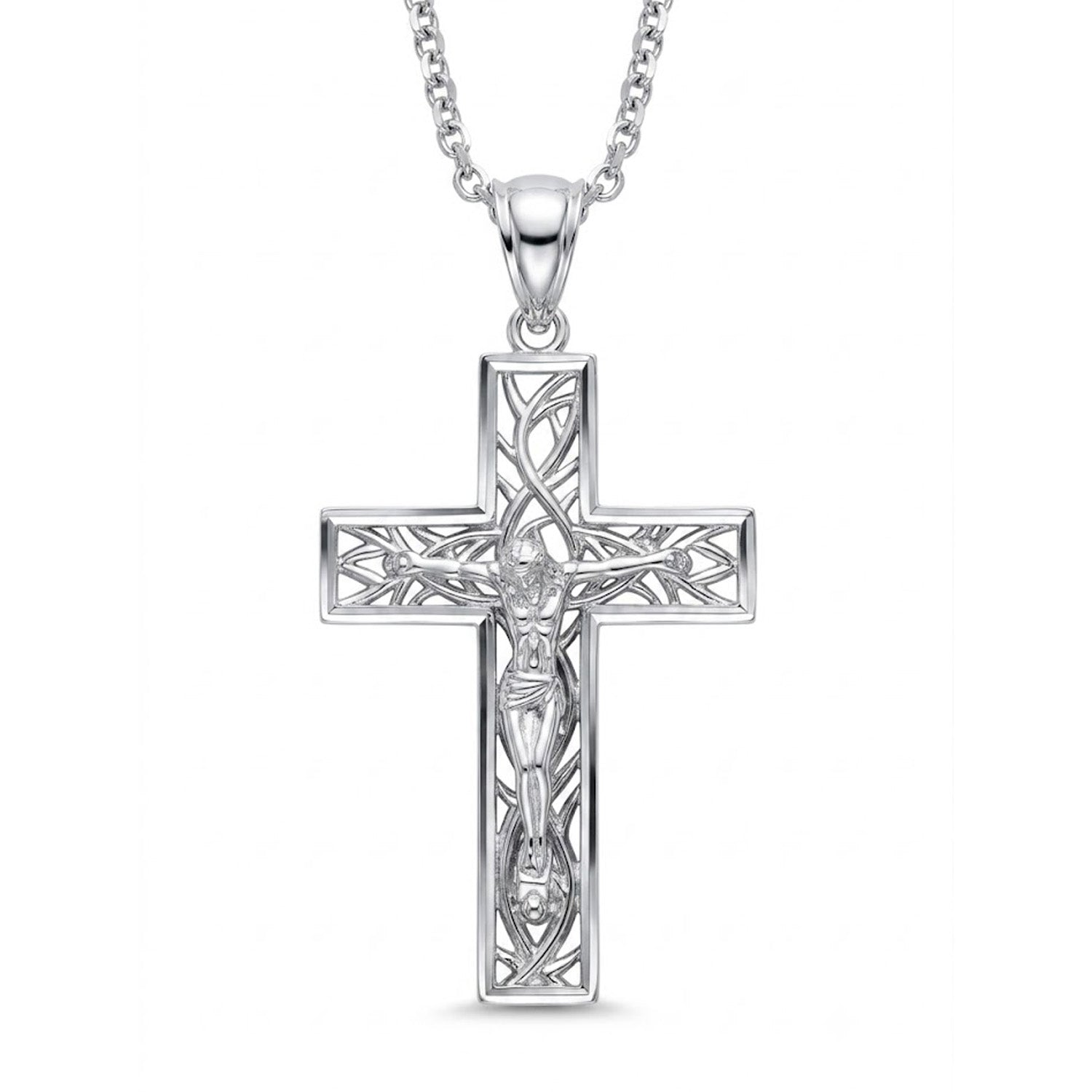 A silver crucifix pendant necklace featuring an intricate filigree design and a detailed figure of Jesus Christ, suspended from a matching silver chain against a plain white background.
