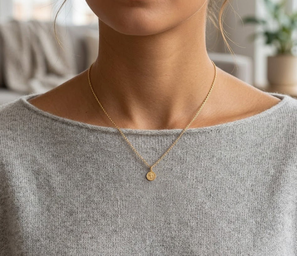 Gold Baptism Cross Medallion Pendant worn by female model with gold rope chain 