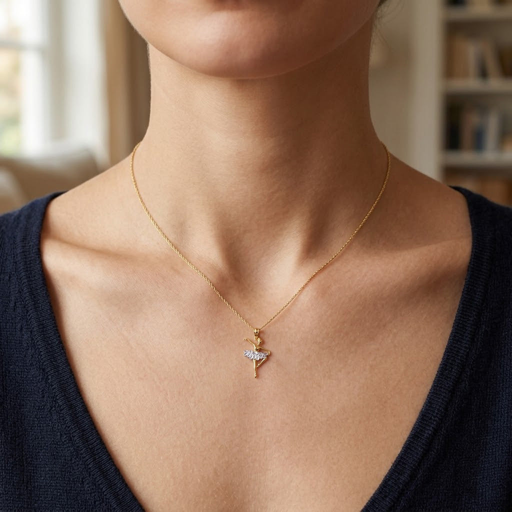 Person wearing a gold ballerina dancer necklace 