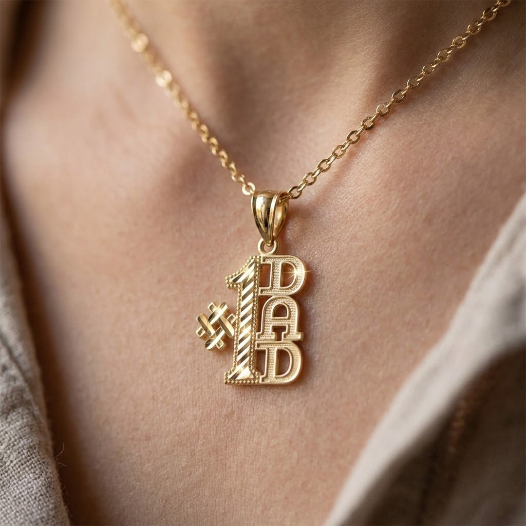 [group:gold-plated] Gold necklace with '#1 DAD' pendant on a person's neck